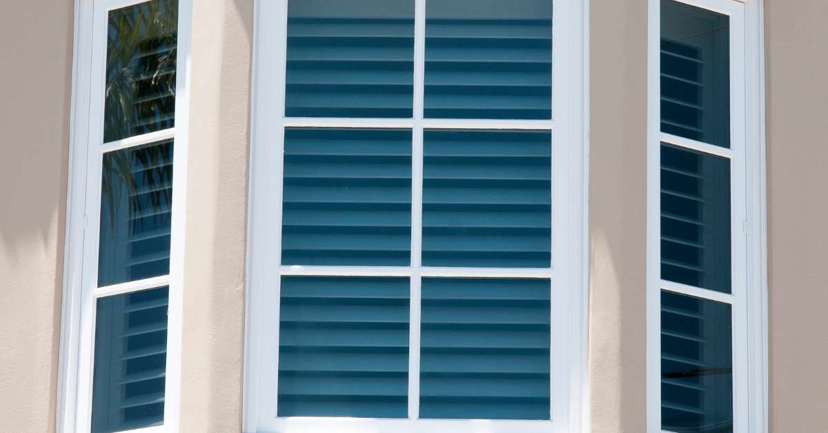 Charming bay window featuring stylish shutters