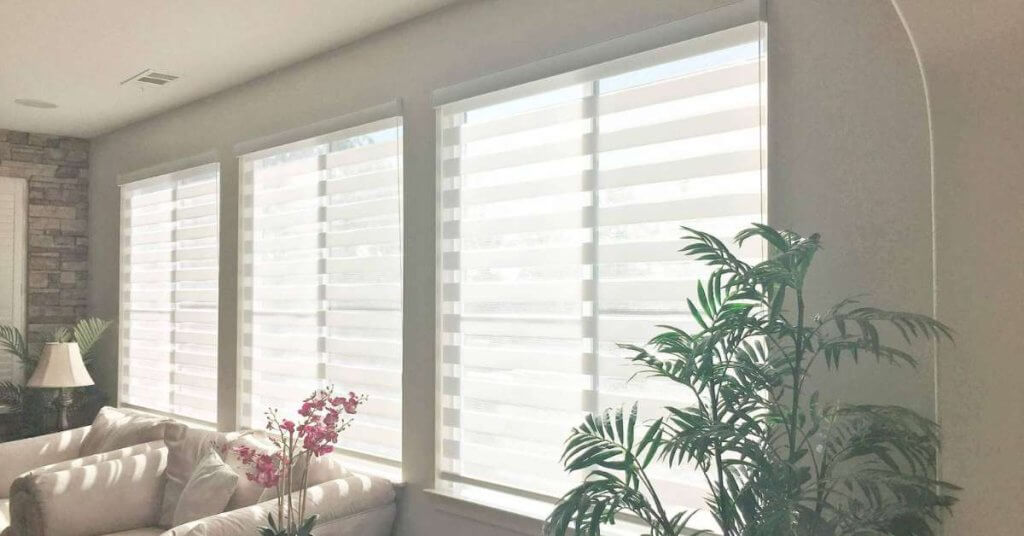 Zebra shades, also known as dual shades, feature alternating bands of sheer and solid fabric. When aligned, the solid bands provide privacy and block light, while the sheer bands allow natural light to filter through.